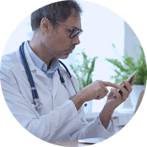 Doctor checking his phone