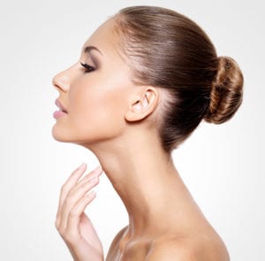 Woman touching her neck in photo