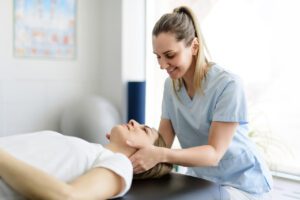chiropractor giving therapy for Neck Pain