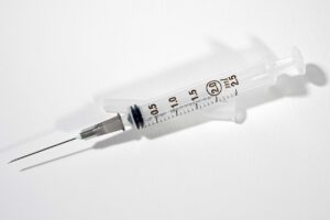 A weight loss injection on a white-neutral background.